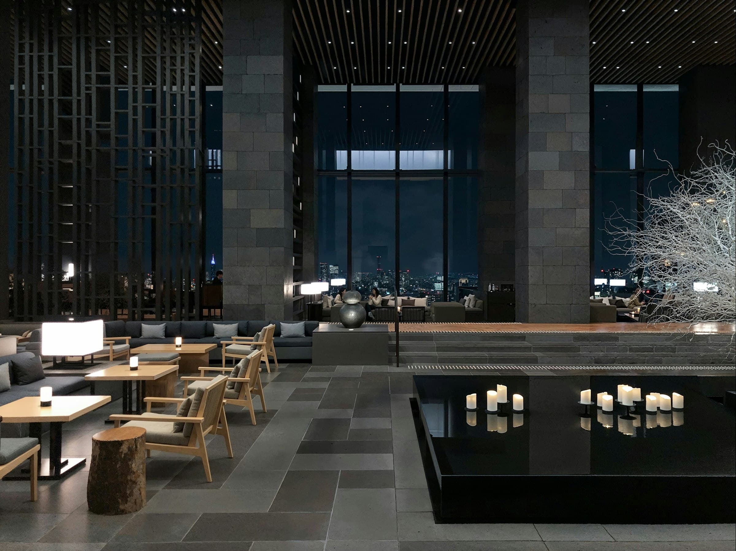 Hotel lounge with a reflecting pool and candlelight