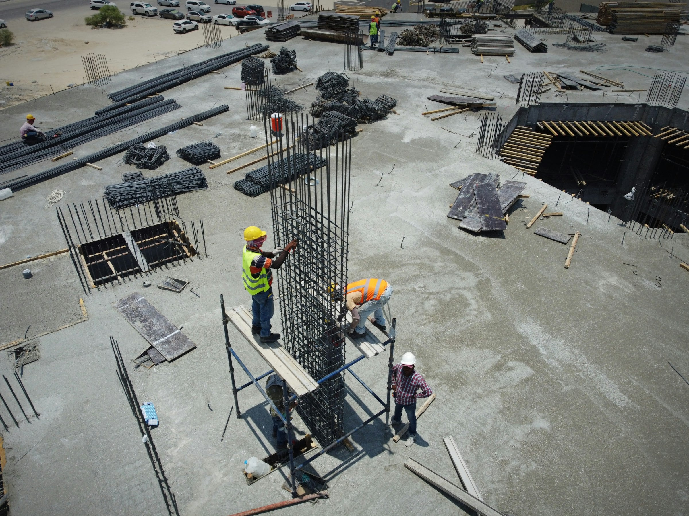 Aerial view of a crew fixing rebar on a concrete deck